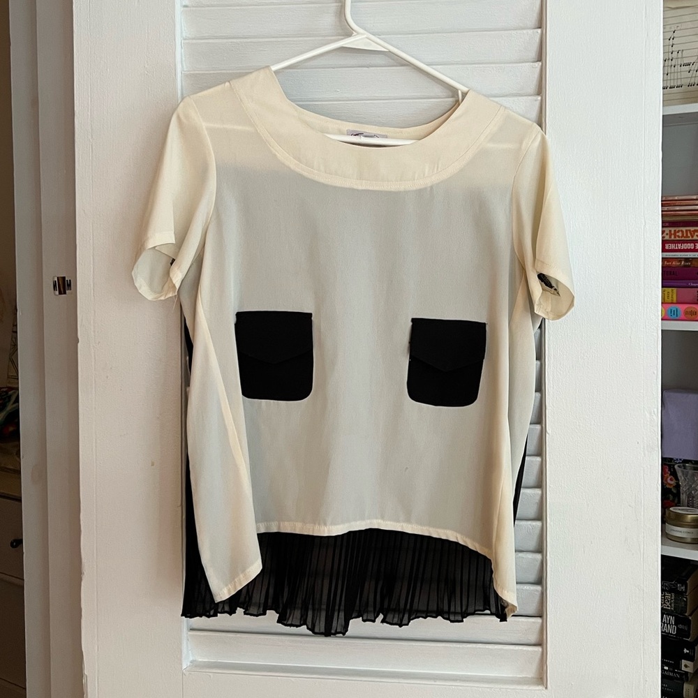 Stylish interesting blouse. Size small.